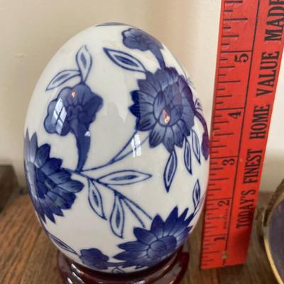 White & blue porcelain egg and enamel on brass dish