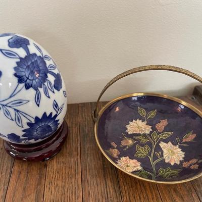White & blue porcelain egg and enamel on brass dish