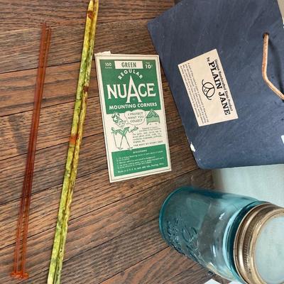 Knitting needles, blue ball jar, sign and mounting corners