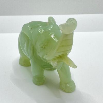 LOT 58: Vintage Asian Carved Collection - Cinnabar snuff bottle, Jade Elephant, Hand Held Filigree Wood Fan and More