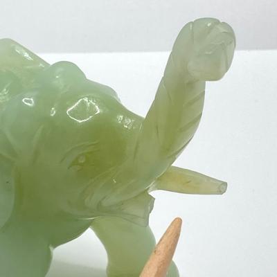 LOT 58: Vintage Asian Carved Collection - Cinnabar snuff bottle, Jade Elephant, Hand Held Filigree Wood Fan and More