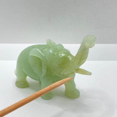 LOT 58: Vintage Asian Carved Collection - Cinnabar snuff bottle, Jade Elephant, Hand Held Filigree Wood Fan and More