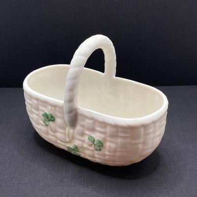 LOT 62: Belleek Bud Vase with Original Box, Miniature Basket, Cream and Sugar Bowls and Northern Ireland Assembly Paperweight