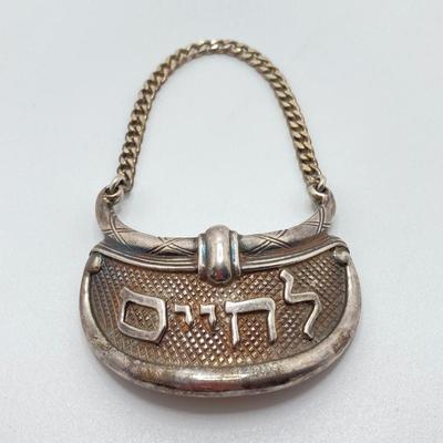 LOT 173: Vintage Sterling Silver "To Life" Celebration Liquor Bottle Decanter Tag - TW 68.06g