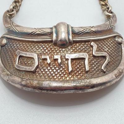 LOT 173: Vintage Sterling Silver "To Life" Celebration Liquor Bottle Decanter Tag - TW 68.06g