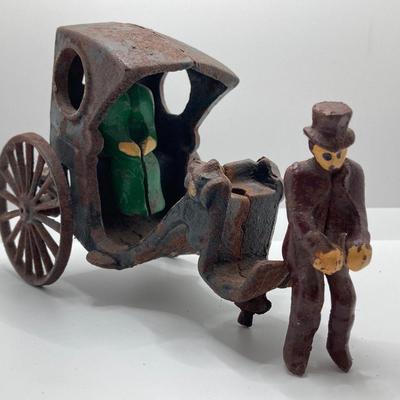LOT 180: Vintage / Antique Cast Iron Horse and Carriage with Driver and Passenger