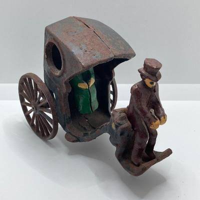 LOT 180: Vintage / Antique Cast Iron Horse and Carriage with Driver and Passenger