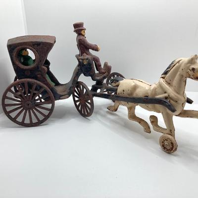 LOT 180: Vintage / Antique Cast Iron Horse and Carriage with Driver and Passenger