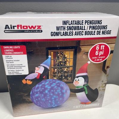 Never opened inflatable holiday penguins