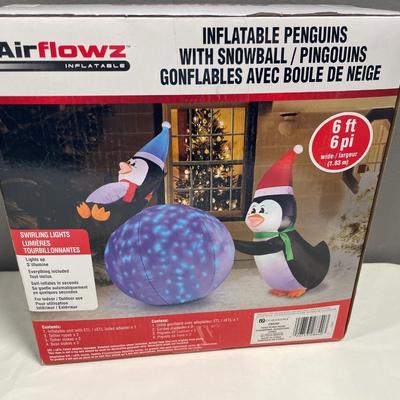 Never opened inflatable holiday penguins