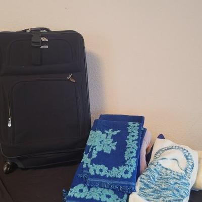 Towels, suitcase