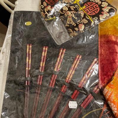 Black table cloth with chopsticks, velveteen, runners, and silk scarf
