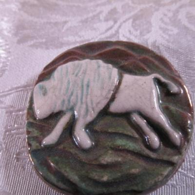 Carved stone buffalo figurine, round ceramic buffalo disc
