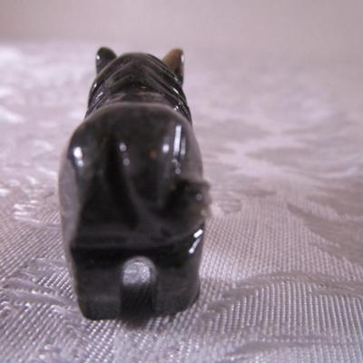 Carved stone buffalo figurine, round ceramic buffalo disc