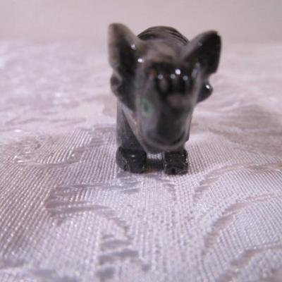 Carved stone buffalo figurine, round ceramic buffalo disc