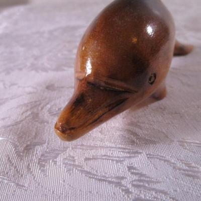 Carved exotic wooden dolphin