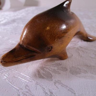 Carved exotic wooden dolphin