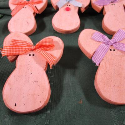 7 wooden craft bunnies that plug into outlets