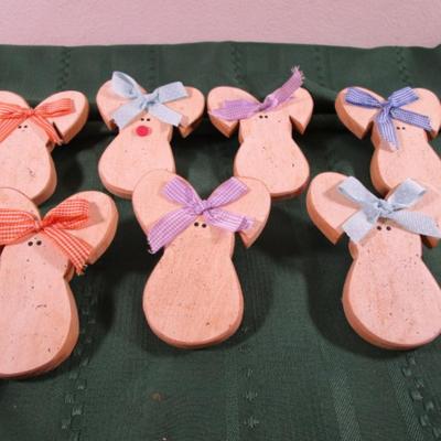 7 wooden craft bunnies that plug into outlets