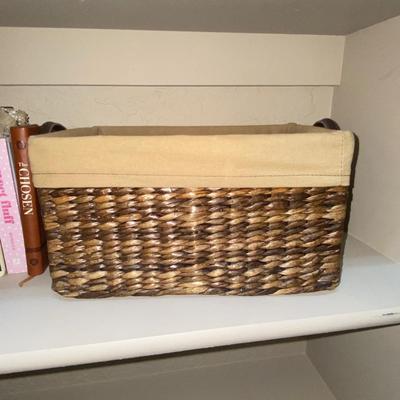 LINED WICKER BASKET, AND A VARIETY OF READING MATERIAL