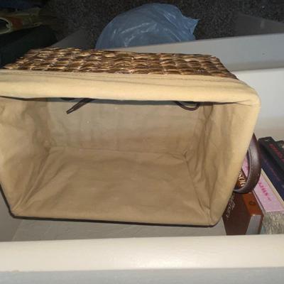 LINED WICKER BASKET, AND A VARIETY OF READING MATERIAL