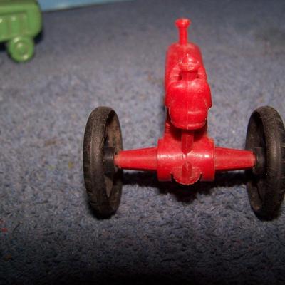 LOT 199 2 SMALL PLASTIC & 1 HARD RUBBER TRACTORS