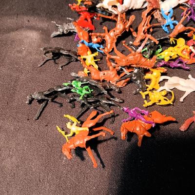 LARGE GROUP OF SMALL COWBOYS, INDIANS AND HORSES
