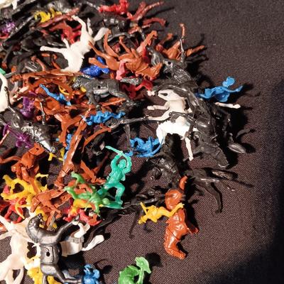 LARGE GROUP OF SMALL COWBOYS, INDIANS AND HORSES