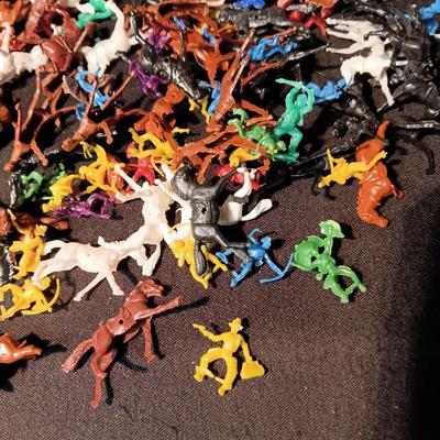 LARGE GROUP OF SMALL COWBOYS, INDIANS AND HORSES