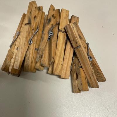 Basket of wood hangers & bag full of clothes pins