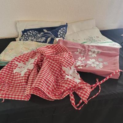 Five vintage table cloths