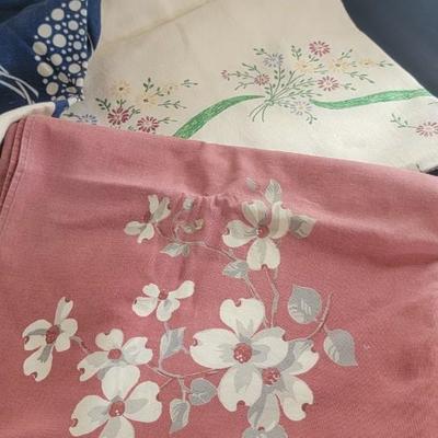 Five vintage table cloths
