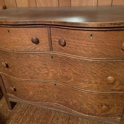 Curved front dresser with mirror