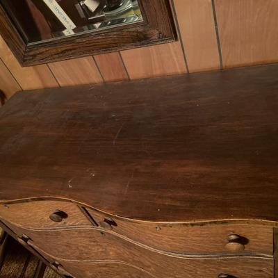 Curved front dresser with mirror