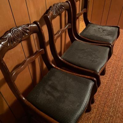 4 dark wood chairs