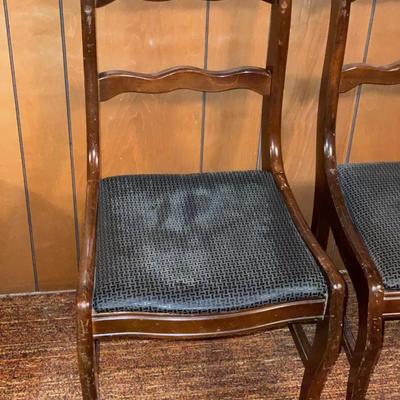 4 dark wood chairs