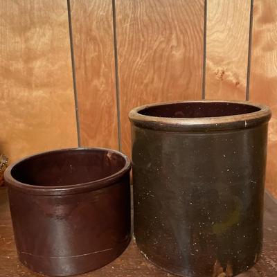 2 brown smaller crocks