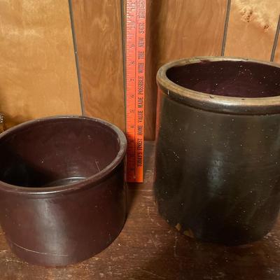 2 brown smaller crocks