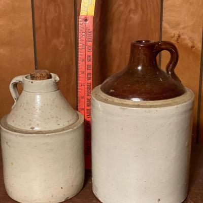 Stamped Minnesota jug with cork and unmarked jug with brown top