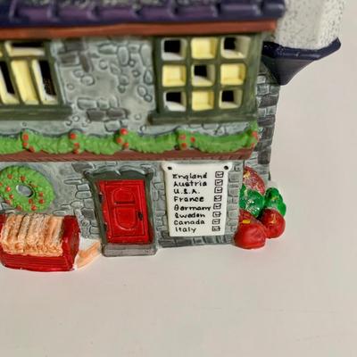 LOT 25 L: St. Nicholas Square Illuminated 2009 "Ryan's Bicycle Shop", 2010 "The Coffee Grounds", Department 56...