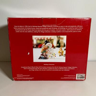 LOT 25 L: St. Nicholas Square Illuminated 2009 "Ryan's Bicycle Shop", 2010 "The Coffee Grounds", Department 56...