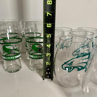 LOT 38 L: NFL Philadelphia Eagles Collection: Glass & Plastic Drinking Glasses, Hand Painted Sugar Skull, Glitter Lamp, & More