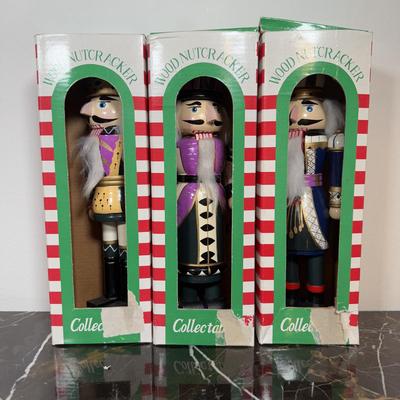 LOT 46D: Vintage Santa Nesting Dolls & Three Wooden Nutcrackers w/ Boxes