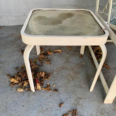 LOT 129 O: Large Outdoor Green Leaf Motif Patio Set: Glass Top Table w/ 6 Chairs, 2 Glass Top Side Tables w/ Glider, Lounger, & Ottoman