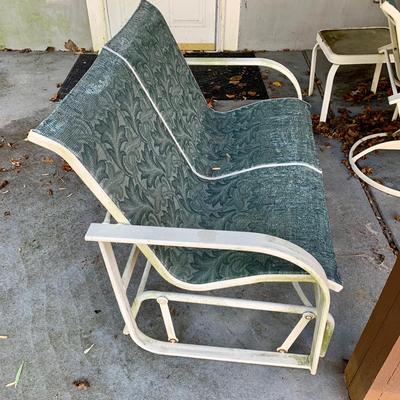 LOT 129 O: Large Outdoor Green Leaf Motif Patio Set: Glass Top Table w/ 6 Chairs, 2 Glass Top Side Tables w/ Glider, Lounger, & Ottoman