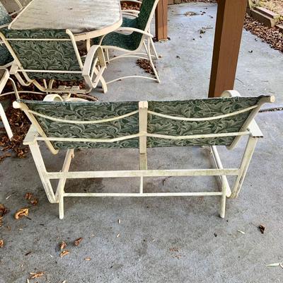 LOT 129 O: Large Outdoor Green Leaf Motif Patio Set: Glass Top Table w/ 6 Chairs, 2 Glass Top Side Tables w/ Glider, Lounger, & Ottoman