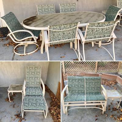 LOT 129 O: Large Outdoor Green Leaf Motif Patio Set: Glass Top Table w/ 6 Chairs, 2 Glass Top Side Tables w/ Glider, Lounger, & Ottoman