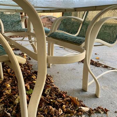 LOT 129 O: Large Outdoor Green Leaf Motif Patio Set: Glass Top Table w/ 6 Chairs, 2 Glass Top Side Tables w/ Glider, Lounger, & Ottoman