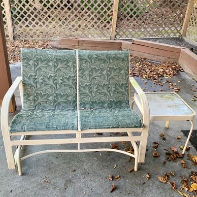 LOT 129 O: Large Outdoor Green Leaf Motif Patio Set: Glass Top Table w/ 6 Chairs, 2 Glass Top Side Tables w/ Glider, Lounger, & Ottoman