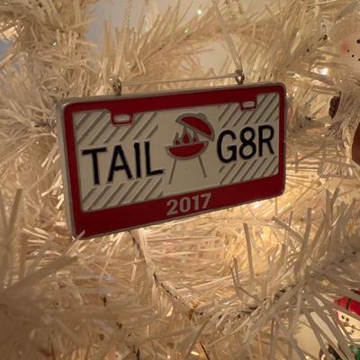 LOT 174D: Eagles Christmas Collection - White 42” Tree w/ Football Or aments, Snowglobe, Santa Hat & More